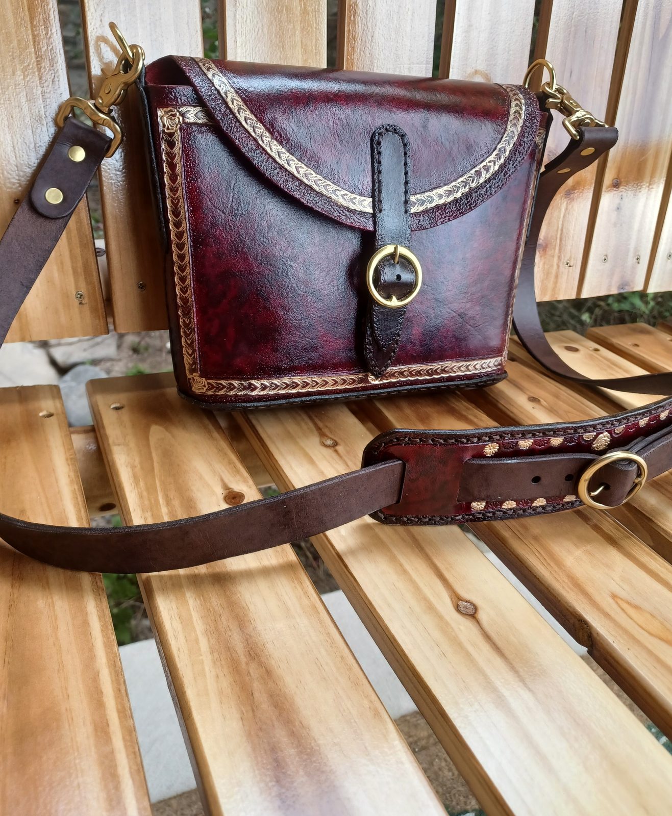 Tooled leather belt with brass buckle