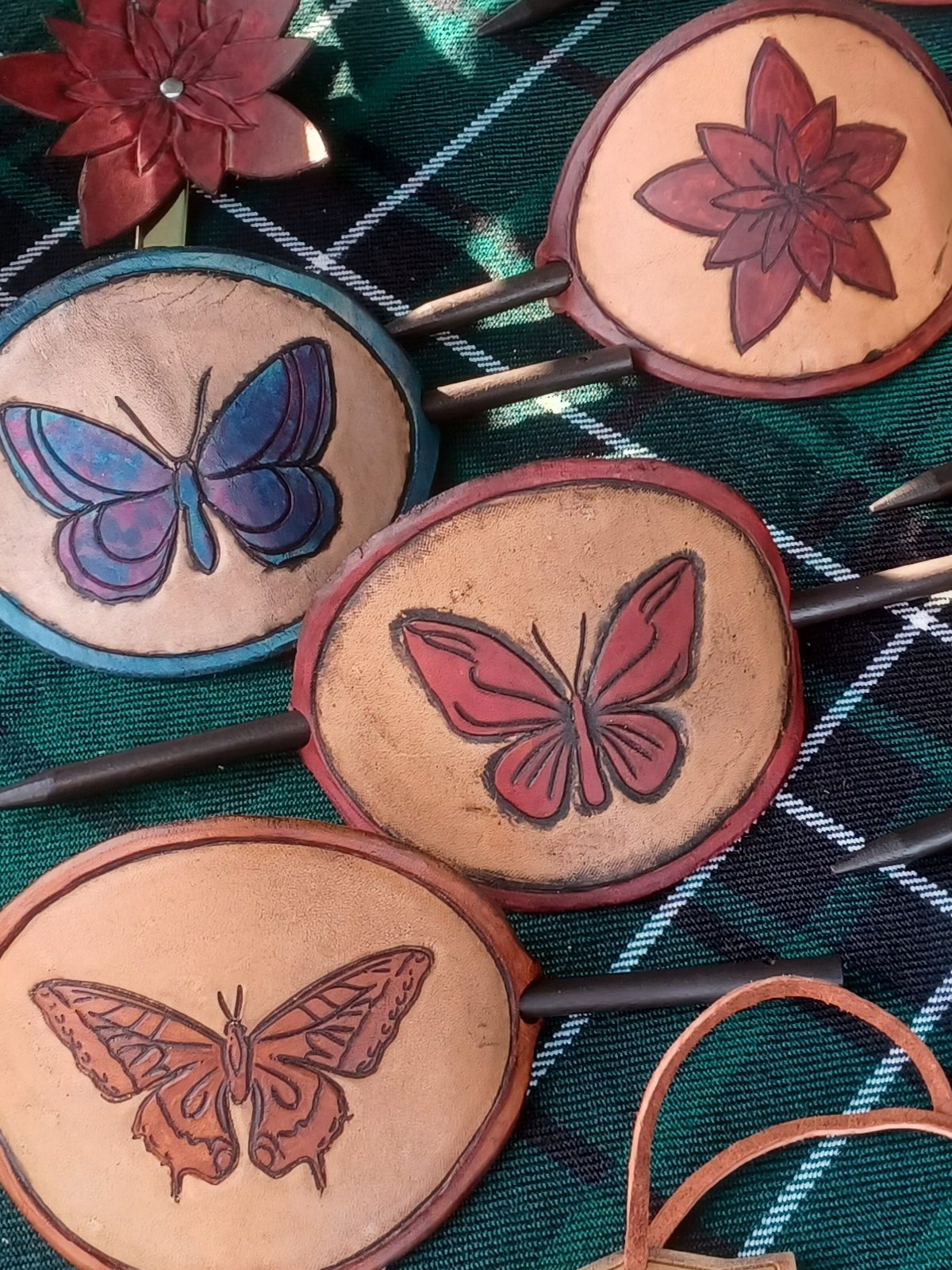 Leather hair pins tooled with butterflies and flowers